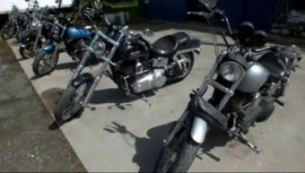 Harley Davidson motorcycles are lined up before a recent event at the Panhandlers MC clubhouse. (Photo by Matt Miller/KTOO)