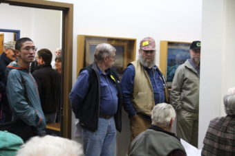 Seniors wearing bright, yellow pins that say "We vote" pack Juneau Assembly Chambers on Sept. 21, 2015, to oppose a a scaling back of a senior sales tax perk.