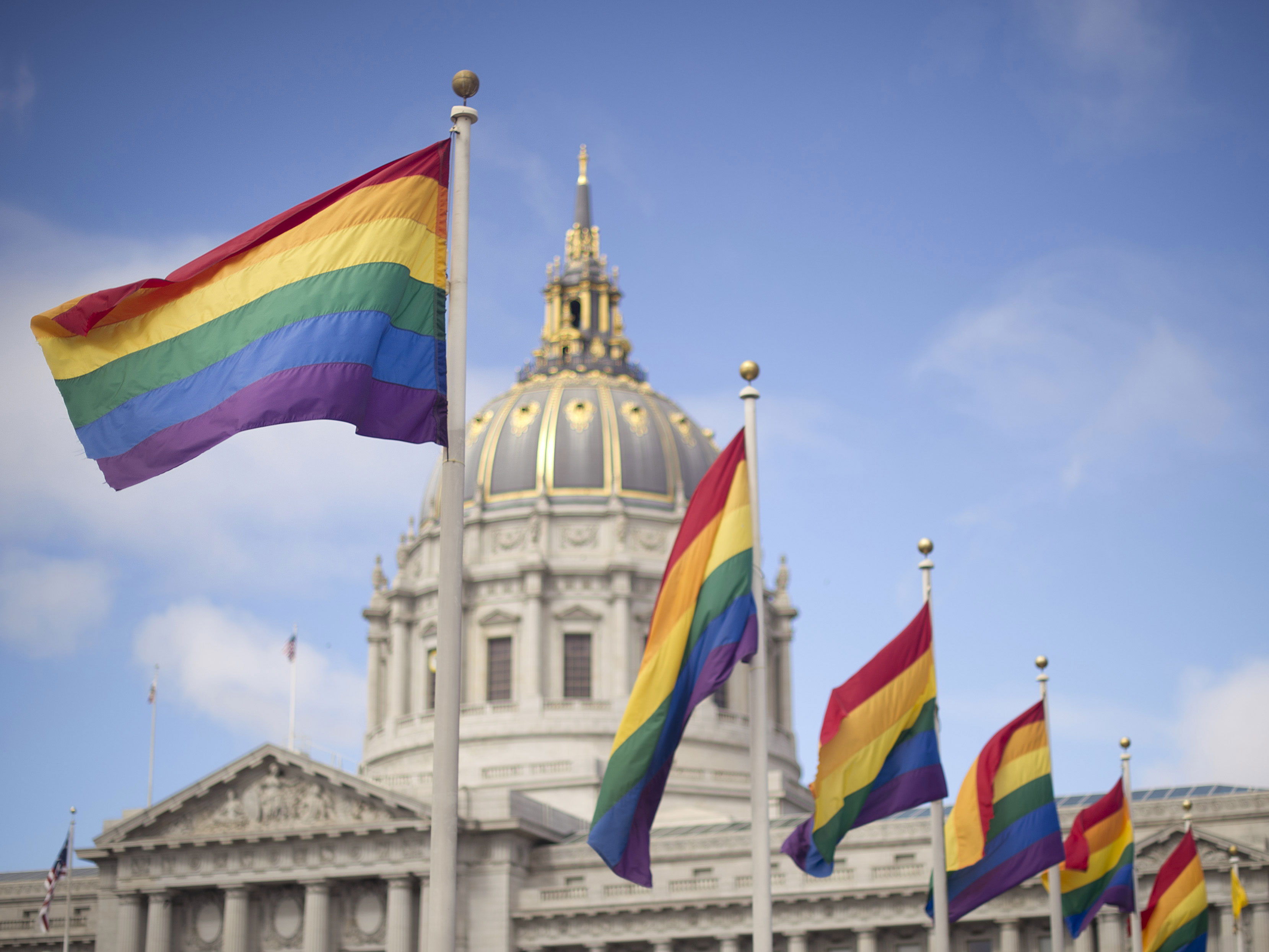 Rainbow flags fly in front of San Francisco City Hall in 2013 after the U.S. Supreme Court cleared the way for same-sex marriage in California. Noah Berger/AP