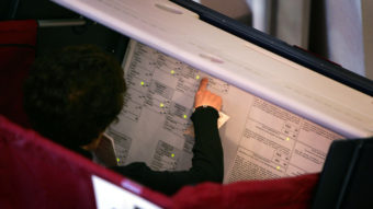 A voter fills out her ballot in Las Vegas in 2004. A new report finds several states, including Nevada, have voting machines more than 10 years old, which are more likely to fail. David McNew/Getty Images