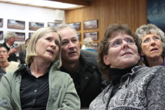 Andi Story and husband Mike watch the results come in Tuesday night. (Photo by Lisa Phu/KTOO)
