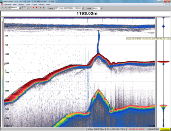 A screen shot from a scientific sounding device shows the newly-discovered volcano and its plume of methane gas. The lower line is an echo, not another volcanic cone. (Photo courtesy Canadian Geological Survey)