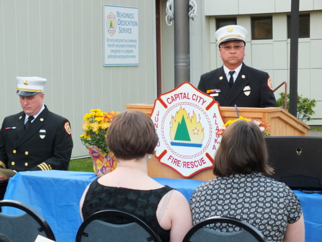 Assistant Fire Chief Ed Quinto leads the memorial observance on Saturday evening. (Photo by Matt Miller/KTOO)