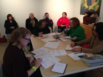 Museum of the Aleutians' Oct. 12 board meeting. Board members (at table, L-R) Melissa Good, Sharon Svarney-Livingston, Eilleen Scott and executive director Zoya Johnson. (Photo by Greta Mart/KUCB)