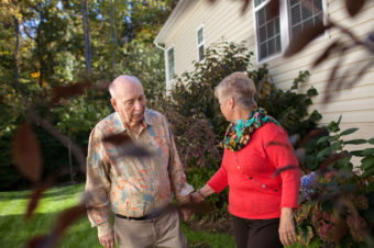 Alan Hoffman, shown with his wife, Nancy, at their home in Dumfries, Va., found that his Parkinson's symptoms improved when he took a cancer drug. Claire Harbage for NPR