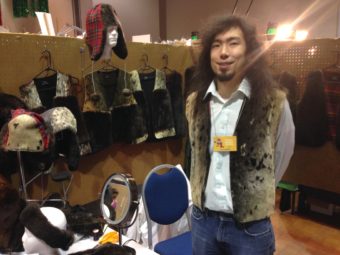 Peter Williams displays his sea otter products during a market at Juneau's Centennial Hall. (Photo by Ed Schoenfeld/CoastAlaska News)