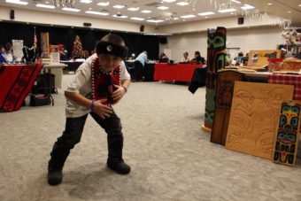 Seven year-old Alex Marx-Beierly dances in his regalia. (Photo by Elizabeth Jenkins/KTOO)