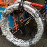 Norio Sasaki spare tires, bear spray and mountain equipment. (Photo by Scott Burton/KTOO)