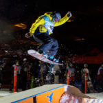 42 - Christian, soars over the box at the Downtown Rail Jam Dec. 19th. (Photo by Mikko Wilson/KTOO)