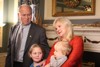 The governor and first lady pose for photos inside the mansion. (Photo by Elizabeth Jenkins/KTOO)