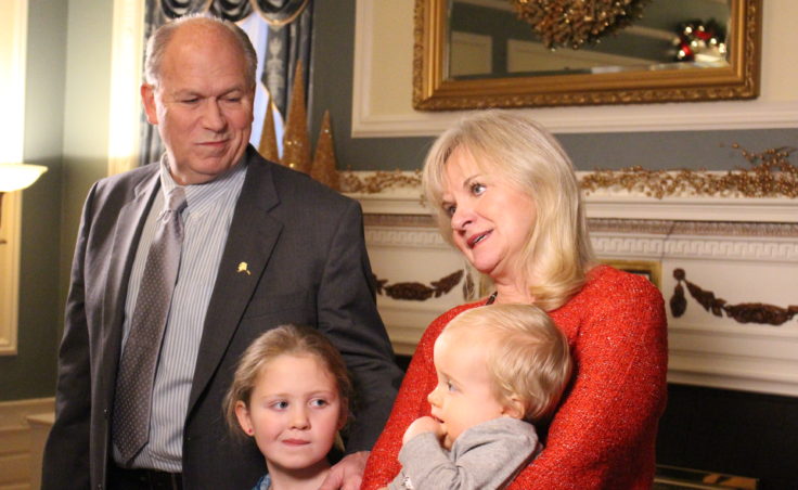 The governor and first lady pose for photos inside the mansion. (Photo by Elizabeth Jenkins/KTOO)