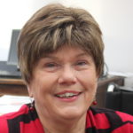 Mary Becker sits in the office of the mayor at Juneau's City Hall on Dec. 3, 2015. (Photo by Lisa Phu/KTOO)