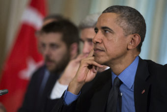 U.S. President Barack Obama listens to Turkish President Recep Tayyip Erdogan during a bilateral meeting, in Paris, on Tuesday in Paris. Evan Vucci/AP