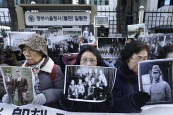 Relatives of Korean women forced into Japanese-run brothels during World War II demonstrate outside the foreign ministry in Seoul, South Korea, on Monday. The two countries announced a deal that included an apology from the Japanese prime minister and a fund to support the 46 surviving Korean women. Ahn Young-joon/AP