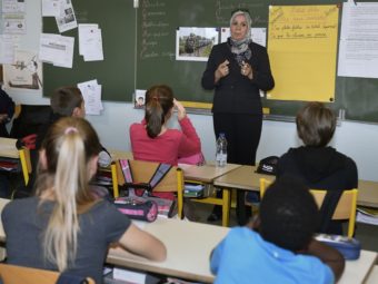 Latifa Ibn Ziaten, shown here speaking to French elementary schoolchildren in March, started an organization to prevent radicalization after her son, a French soldier, was killed by an Islamist gunman in March 2012. Pascal Pavani/AFP/Getty Images