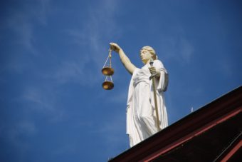 Lady Justice at the U.S. Supreme Courthouse in Washington, D.C. (Public Domain photo)