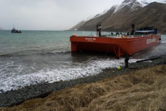 The bright orange Resolve Ibis (far left), an oil spill response barge capable of sopping up over 20,000 gallons of fuel, has a five-year mooring permit from the Alaska Department of Natural Resources. Photo by Ethan Nichols)