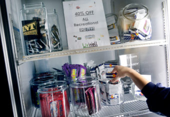 A budtender prepares an edible sale for a customer at LivWell Broadway in Denver. Craig F. Walker/Denver Post via Getty Images