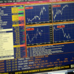 This digital version of the old stock market ticker is one of many screens used to follow economic trends at the Alaska Permanent Fund Corp. (Photo by Skip Gray/360 North)