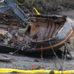 Excavators demolish the tug Challenger on March 8, 2016 (Photo by David Purdy/KTOO)