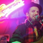 A picture of Jason Overby as he performs with the Overby Family Band at the Rendezvous at the 40th Folk Fest in 2014. (Photo by Annie Bartholomew/KTOO)