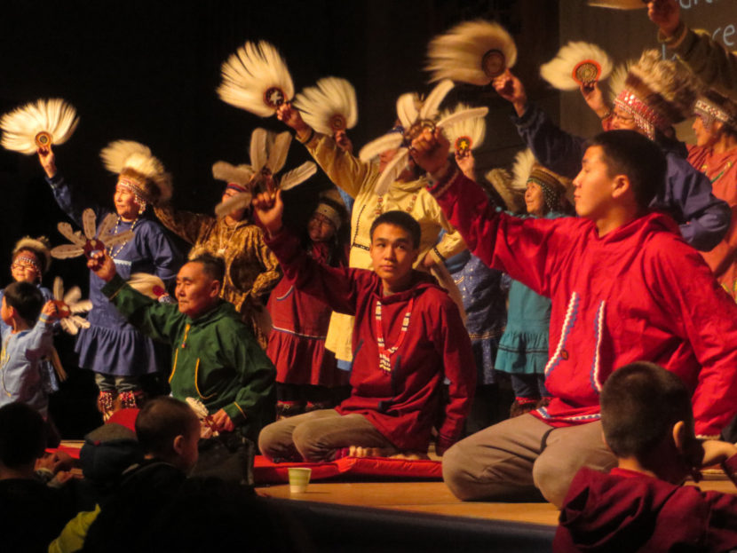 Byron Nicholai (center) and the Toksook Bay Traditional Dancers perform at the 2016 Cama-i Dance Festival in Bethel. (Photo by Laura Kraegel/KNOM)