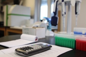 The lab uses new technology, including the ELISA and receptor binding assay (RBA), to test for the presence of toxins in shellfish, without resorting to live mice. (Emily Kwong/KCAW)