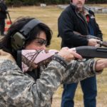 Cathy Tilton participates in the trap shooting event with a shotgun during the 19th Annual Legislative Team Shoot. (Photo by David Purdy/KTOO)