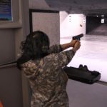 Cathy Tilton participates in the handgun event during the 19th Annual Legislative Team Shoot. (Photo by David Purdy/KTOO)