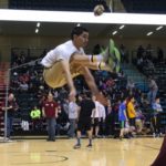 A Mount Edgecumbe student competes in the two-foot high kick, where the competitor pikes forward to kick a suspended ball. The Two-Foot High Kick was historically used to recognize the success of a spring hunt. (Photo by Shady Grove Oliver)