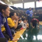 Mount Edgecumbe students yell Jeremy’s name from the sidelines, as he competes in the male seal hop event at the 2016 Native Youth Olympics in Anchorage. (Photo by Emily Kwong/KCAW)