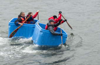 Two teams compete in the Taku Tote Races at the 2016 Juneau Maritime Festival (Photo by David Purdy/KTOO)
