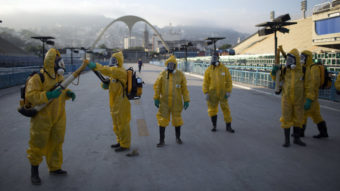 Health workers get ready to spray insecticide to combat the Aedes aegypti mosquitoes that transmits the Zika virus in January, under the bleachers of the Sambadrome in Rio de Janeiro, which will be used for the Archery competition in the 2016 summer games.