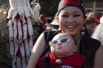 Nakiya Lundy, 19, and her daughter Luna Lundy, 8 months, wait for their spot in a processional and grand entrance on Wednesday, June 8, 2016, in Juneau, Alaska. (Photo by Rashah McChesney/KTOO)