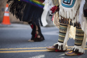 Hundreds gather to march during a processional and grand entrance on Wednesday, June 8, 2016, near Juneau, Alaska. Celebration is a biennial festival of Tlingit, Haida and Tsimshian tribal members put on by the Sealaska Heritage Institute. (Photo by Rashah McChesney/KTOO)