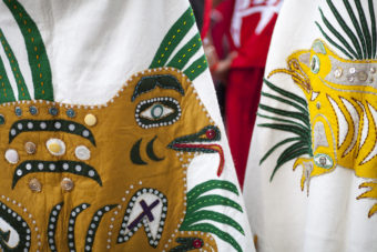 Hundreds gather to march during a processional and grand entrance on Wednesday, June 8, 2016, near Juneau, Alaska. Celebration is a biennial festival of Tlingit, Haida and Tsimshian tribal members put on by the Sealaska Heritage Institute. (Photo by Rashah McChesney/KTOO)