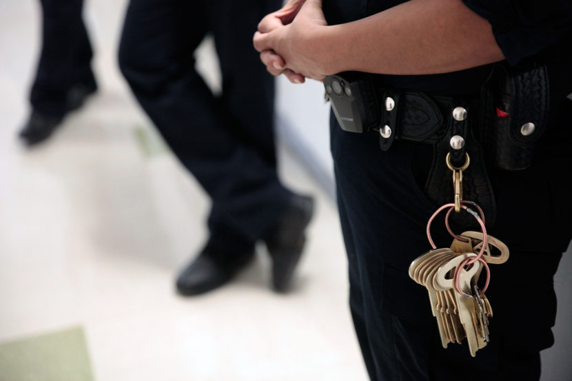 Corrections officers wait outside of a cell during a weekly inspection at the Lemon Creek Correction Center on June 18, 2016 in Juneau, Alaska. (Photo by Rashah McChesney/KTOO)