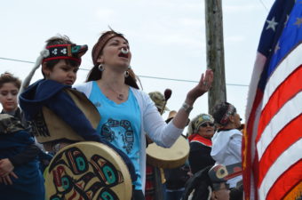 Hundreds of people lined the shores of Douglas Harbor, June 8, 2016 to welcome the canoes. (Photo by Jennifer Canfield/KTOO)