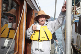Bill Bennett relaxes before getting into a canoe to finish paddling from Angoon to Juneau on Wednesday, June 8, 2016, near Juneau, Alaska. The One People Canoe Society group began the trip on June 2. Their landing on Douglas Island is the unofficial beginning of Celebration. (Photo by Rashah McChesney/KTOO)