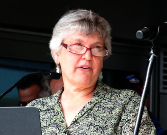 Nancy Purvis talks about her great-grandfather, Father Andrew P. Kashevaroff, during grand opening of the new state library, archives and museum on June 6, 2016. (Photo by Matt Miller/KTOO)
