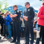 Juneau Police Department Lieutenant Kris Sell and Chief of Police Bryce Johnson light candles at the vigil for those affected by the Orlando shootings. (Photo by Annie Bartholomew/KTOO)