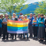 Members of the Juneau community gathered in Marine Park for a vigil for those affected by the Olando Shootings on Monday, June 14. (Photo by Annie Bartholomew/KTOO)