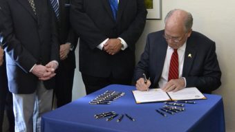 Gov. Bill Walker signs Senate Bill 91, a criminal justice reform bill, on July 11, 2016, at Haven House transitional housing in Juneau. (Photo courtesy Alaska Governor's Office)