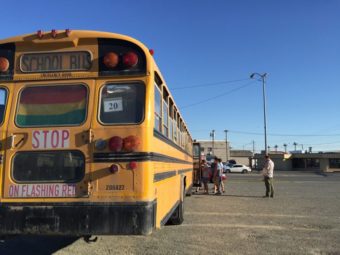 Participants load the bus for the LGBTQ history bus tour outside of the Raven. (Photo by Anne Hillman/Alaska Public)