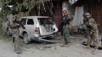 Afghan soldiers inspect a destroyed vehicle after an operation in Nangarhar province, Afghanistan, on July 26, the day the Pentagon says a drone strike killed the leader of the Islamic State in the region. Noorullah Shirzada/AFP/Getty Images