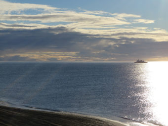 The U.S. Coast Guard icebreaker, Healy, sits just offshore of Barrow, shortly before setting sail on Arctic Shield 2013.