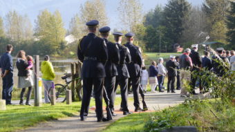 JPD Honor Guard waits to escort the flag to the memorial..