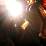 Raven Natkong dances in the spotlight at Rendezvous during Friday's amateur drag show. (Photo by Tripp J Crouse/KTOO)