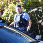 Juneau Police Officers search Wednesday afternoon a property in the 300-block of Village St., downtown Juneau after serving a search warrant on the property. Items from recent burglaries were recovered, including stolen property from The Observatory bookstore, Police Lt. David Campbell said. (Photo by Tripp J Crouse/KTOO)