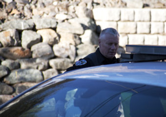 Juneau Police Officers search Wednesday afternoon a property in the 300-block of Village St., downtown Juneau after serving a search warrant on the property. Items from recent burglaries were recovered, including stolen property from The Observatory bookstore, Police Lt. David Campbell said. (Photo by Tripp J Crouse/KTOO)
